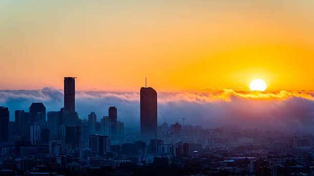 istock Foggy Sunrise Over City Skyline 2236846397