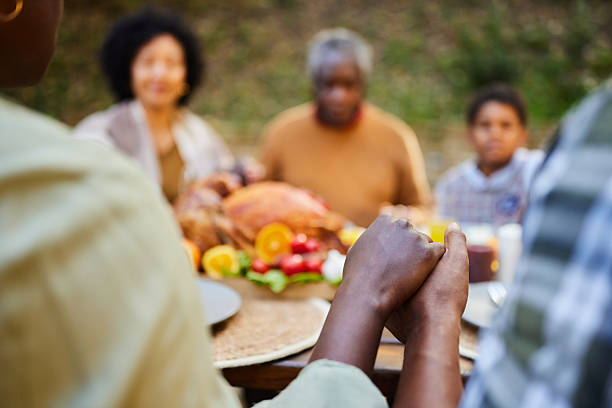 istock Praying before Thanksgiving lunch at picnic table! 2236848619