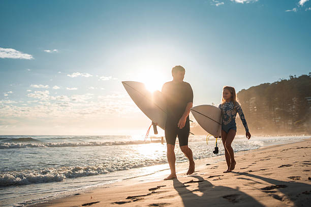 istock Joyful Caucasian Father and Daughter Strolling Beach at Sunrise 2236849487