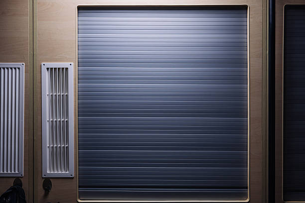 istock Closed rolling shutter door and ventilation grilles in a modern interior design 2236851003