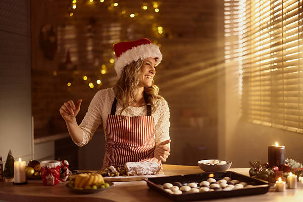 istock Cheerful woman preparing snacks on New Year's at home. 2236851005