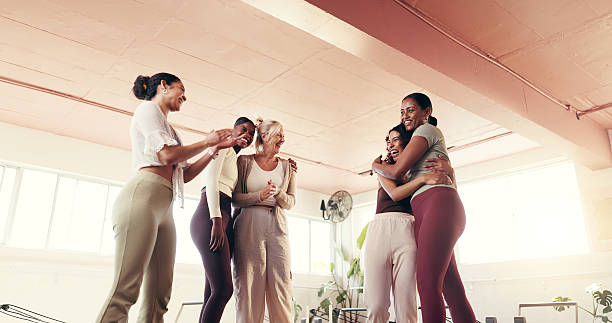 istock Happy, pilates class and girl friends in studio with bonding, connection or activity together. Smile, laugh and women at yoga workout for health, wellness or fitness with talking and hugging at gym. 2236852507