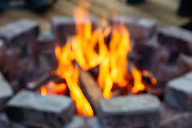 The stone brick construction provides durability and heat resistance, while allowing airflow for sustained burning, ensuring controlled fire behavior, with selective focus on fire