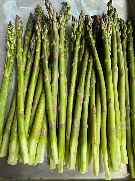 istock Fresh green asparagus stalks with smooth, firm texture and tightly closed tips, showcasing vibrant color, natural shine, and crisp freshness in close-up detail 2236853051