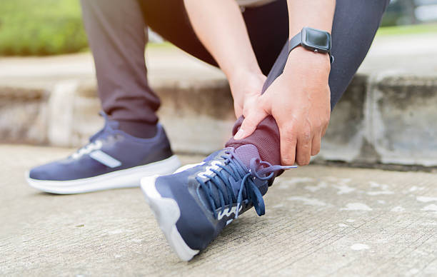 istock Runner suffering ankle pain during outdoor workout 2236853564