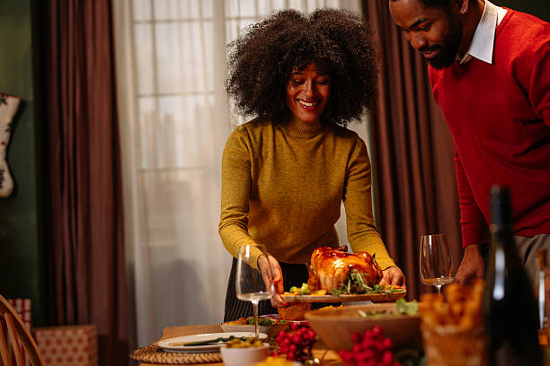 istock Couple serving Christmas turkey at home 2236853775
