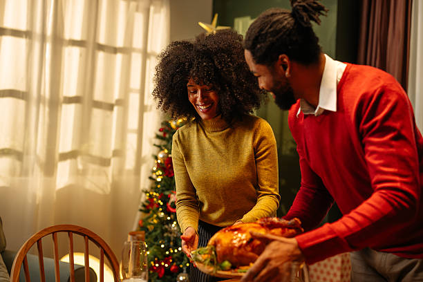 istock Couple bringing roasted turkey for Christmas dinner 2236853782