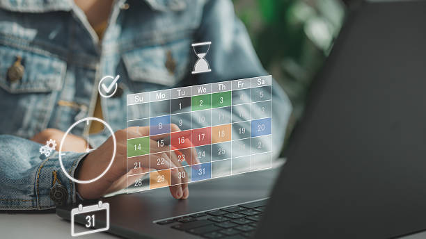 istock Hand using laptop with virtual calendar and schedule icons, representing time management, task planning, productivity organization, event scheduling, and efficient workflow in digital business. 2236856863