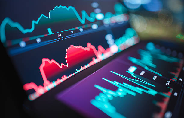 istock Predictive AI for trading: A professional reviews algorithmic insights and stock data on a mobile device 2236859304