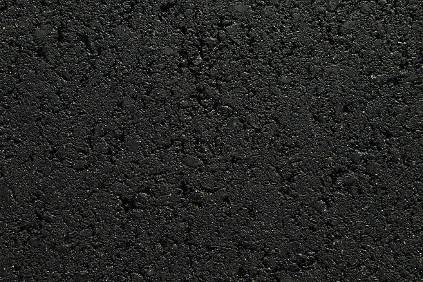 istock New dark black asphalt background. Closeup. Empty place for text. Top down view. 2236859568