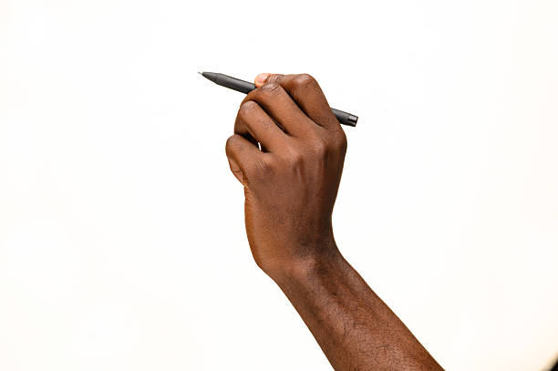istock Hand holding black pen against white background 2236862185