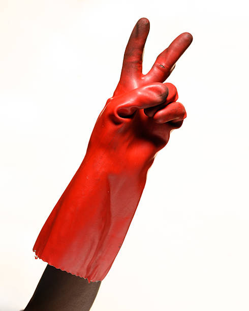 istock Red glove hand showing peace sign 2236863448