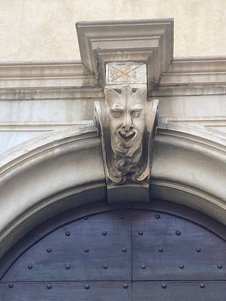 istock Close Up Allegorical Figure Head Above Arched Doorway 2236863895