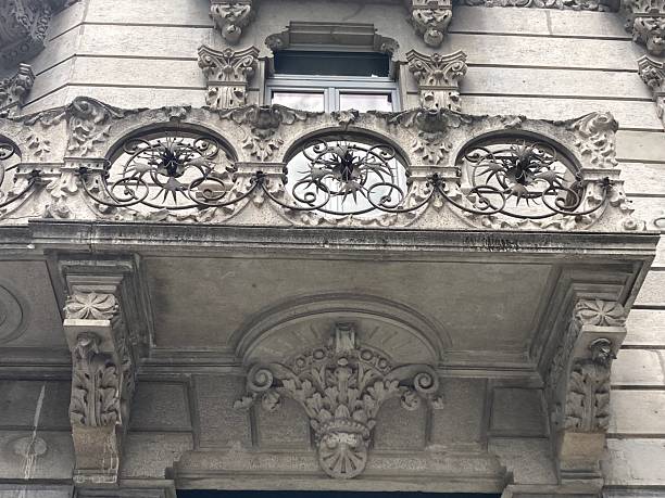 istock Decorated Wrought Iron Balcony with Window with Highly Decorated Pediment 2236863982