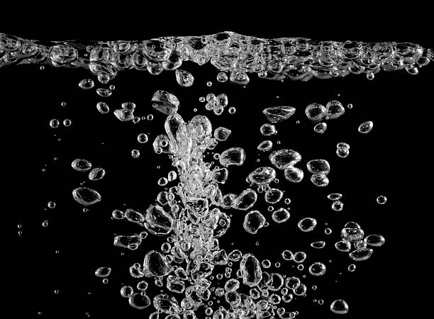 istock Realistic underwater air bubbles rising in clear water isolated on a black background, perfect for beverage advertising, freshness concepts, clean design, and creative digital artwork. 2236866621