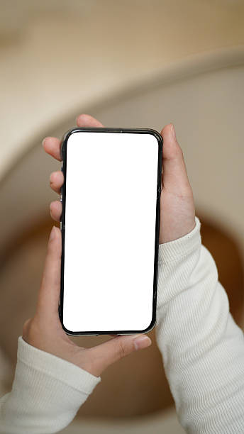 istock A hand holds a smartphone with a blank white screen against a blurred background 2236868685