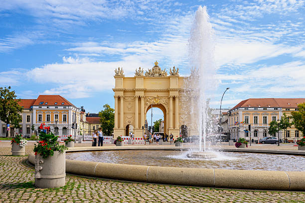 view on Brandenburg Gate and fountain in Potsdam in summer