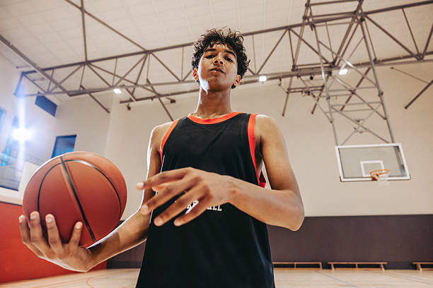 istock Teen basketball player practicing indoors 2236872940