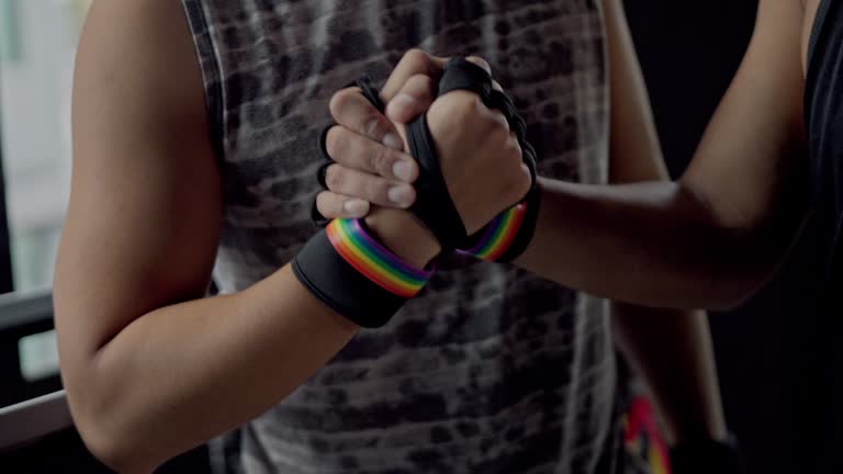 Love couple exercise together at fitness gym. LGBTQ and Prime Day concept. Man activity with friend.