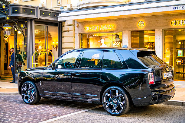 Rolls Royce Cullinan luxury SUV parked on the street in front of the Giorgio Armani store in Monte Carlo, Monaco along the Côte d'Azur.