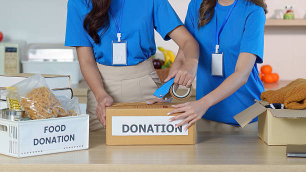 istock Volunteers organizing donation items for community support 2236875523