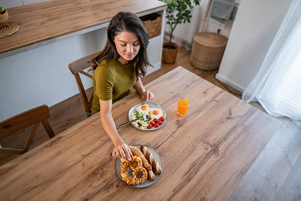 istock Woman having healthy homemade breakfast in kitchen 2236875700
