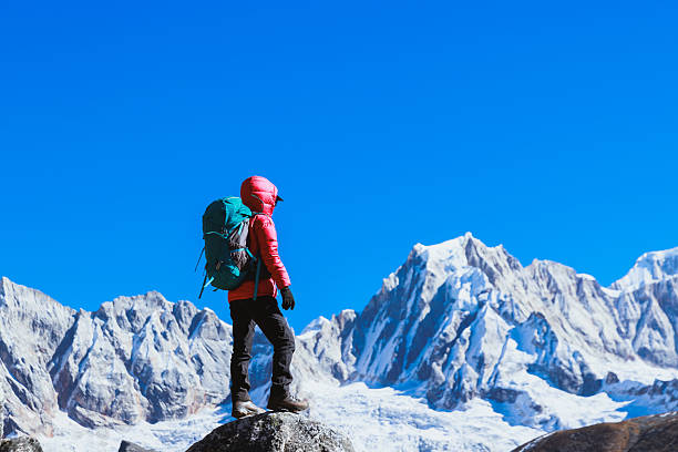 istock Successful woman hiker on high altitude mountain top 2236877471