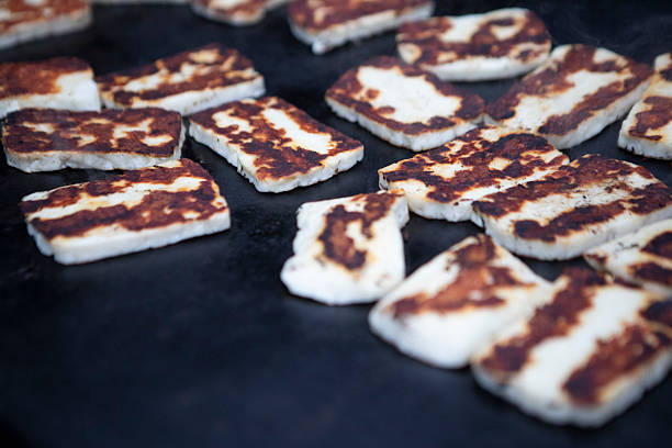 istock Halloumi slices cooking on a barbecue griddle 2236878557