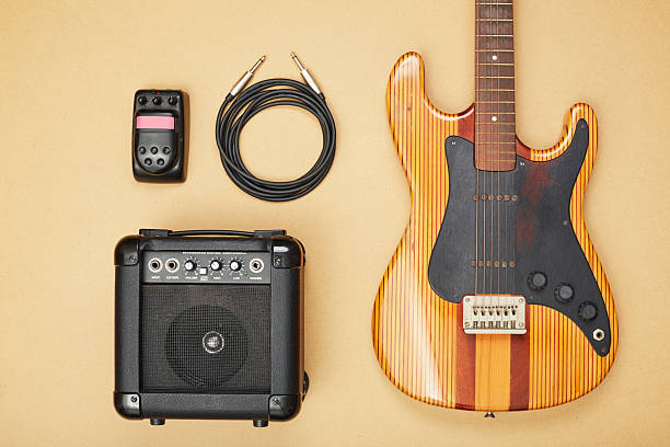 istock Electric guitar with an amplifier, guitar pedal and cable flat lay 2236883438