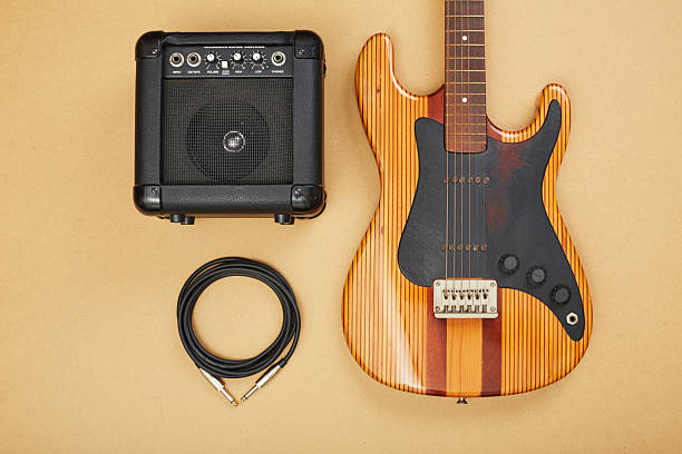 istock Electric guitar with an amplifierl and cable flat lay 2236883471