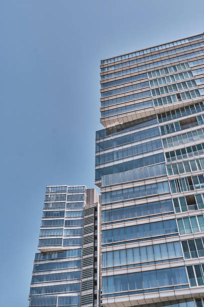 istock Modern glass office buildings against clear blue sky 2236884897