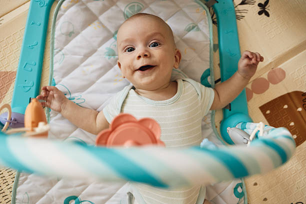istock Happy baby smiling on activity play mat 2236884934