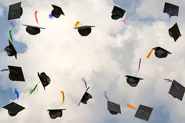 istock Graduation caps thrown in the sky 2236890526