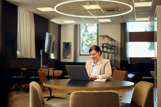 istock Professional Woman Working on Laptop in a Modern Office Setting 2236893658