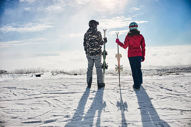 ski poles on a snowy slope on a sunny day in the alps