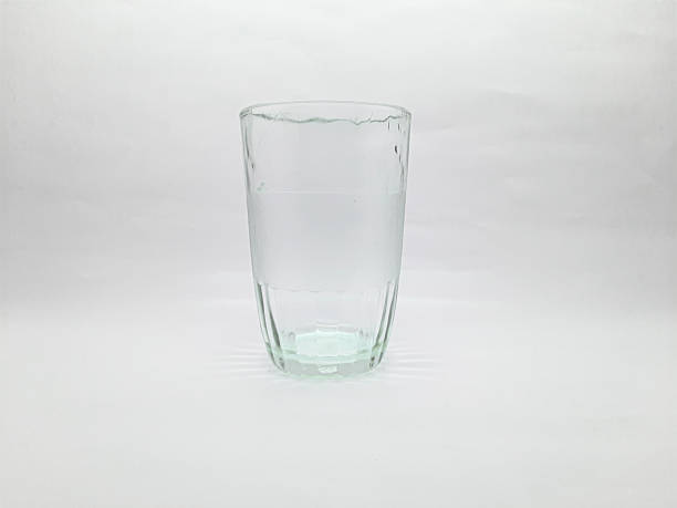 istock Clear Glass Of Water On White Studio Background With Reflections And Light 2236896291