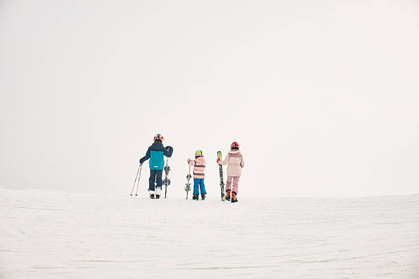 istock Happy kids enjoying break from skiing 2236896494