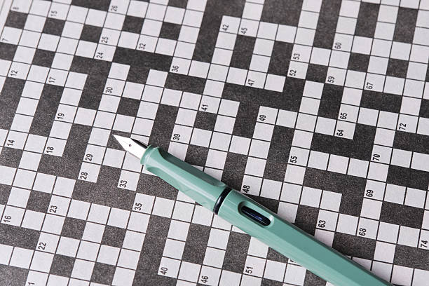 istock Fountain pen is lying crossword puzzle sheet. 2236896984