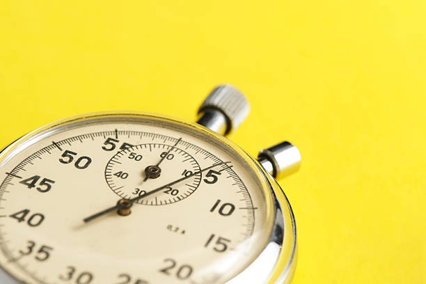 istock Mechanical stopwatch yellow background closeup. 2236896995