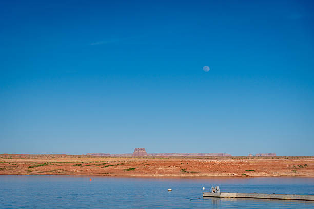 US. Lake Powell. Colorado River. Pleasant boat ride on a warm day. Beautiful sunny warm day. Lake water reflects the blue sky and clouds