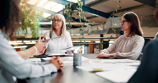 istock Portfolio, ideas or designers talking in meeting for creative project, startup or feedback. Review, interior design paperwork and people with teamwork for brainstorming, planning or collaboration 2236900380