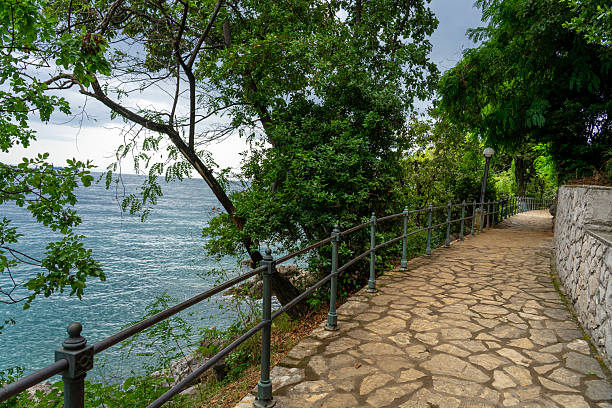 istock Stone seaside path Lungomare with railing along Adriatic coast in Opatija, Croatia 2236901876