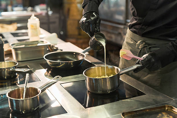 istock Male Chef Preparing Potato Side Dish in Professional Restaurant Kitchen 2236902541