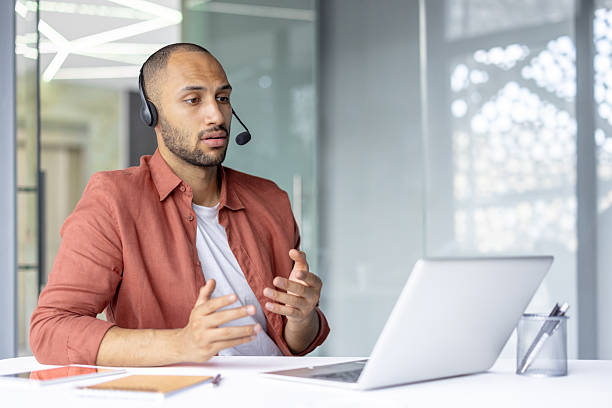 istock Business professional communicating on a video conference in modern office. 2236902887