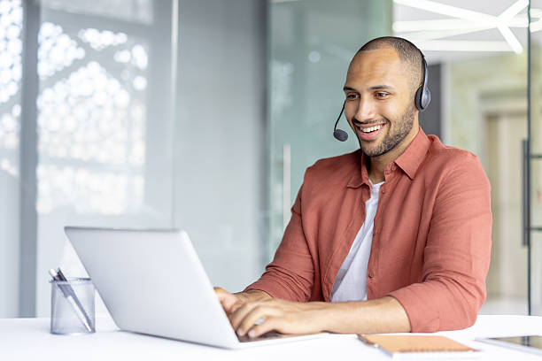 istock Business professional on a video call with headset in a modern workspace 2236902888