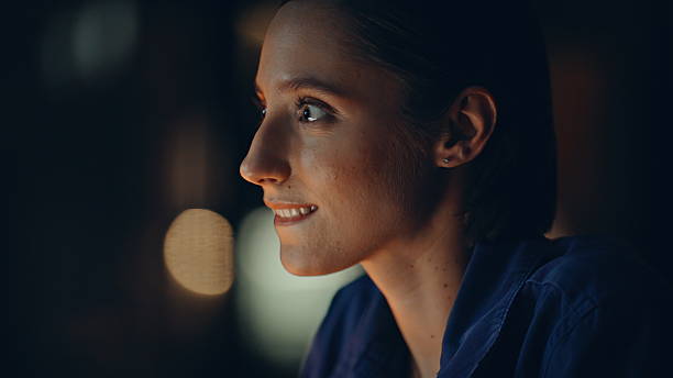 istock Portrait late manager thinking on creative project overtime. Smiling woman 2236903220