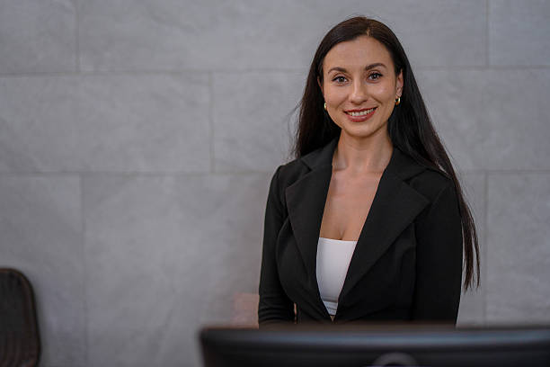 istock A receptionist is working at the hotel's counter. 2236903943