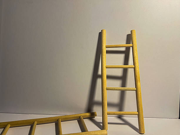 istock Mini wooden ladder with shadow on neutral background 2236906996