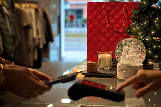 istock Hands making contactless payment during holiday shopping season 2236907372