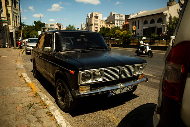 A vintage Lada 2107, also known as Lada Riva or Lada Nova, parked along a street in Istanbul, Turkey. This Soviet-era sedan, produced by AvtoVAZ, remains an iconic symbol of Eastern European and Middle Eastern car culture. The image highlights the car’s retro design and worn condition, reflecting its enduring presence in urban Turkey. Useful for illustrating themes of automotive history, retro culture, Soviet influence, and city life in Istanbul.